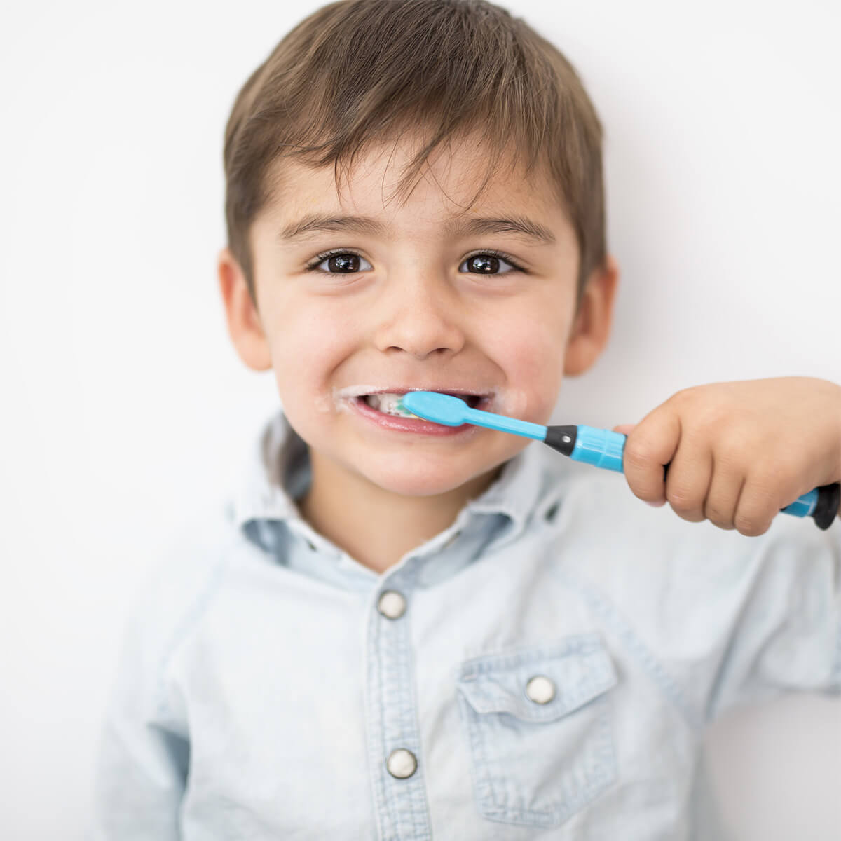 Young boy brushing teeth